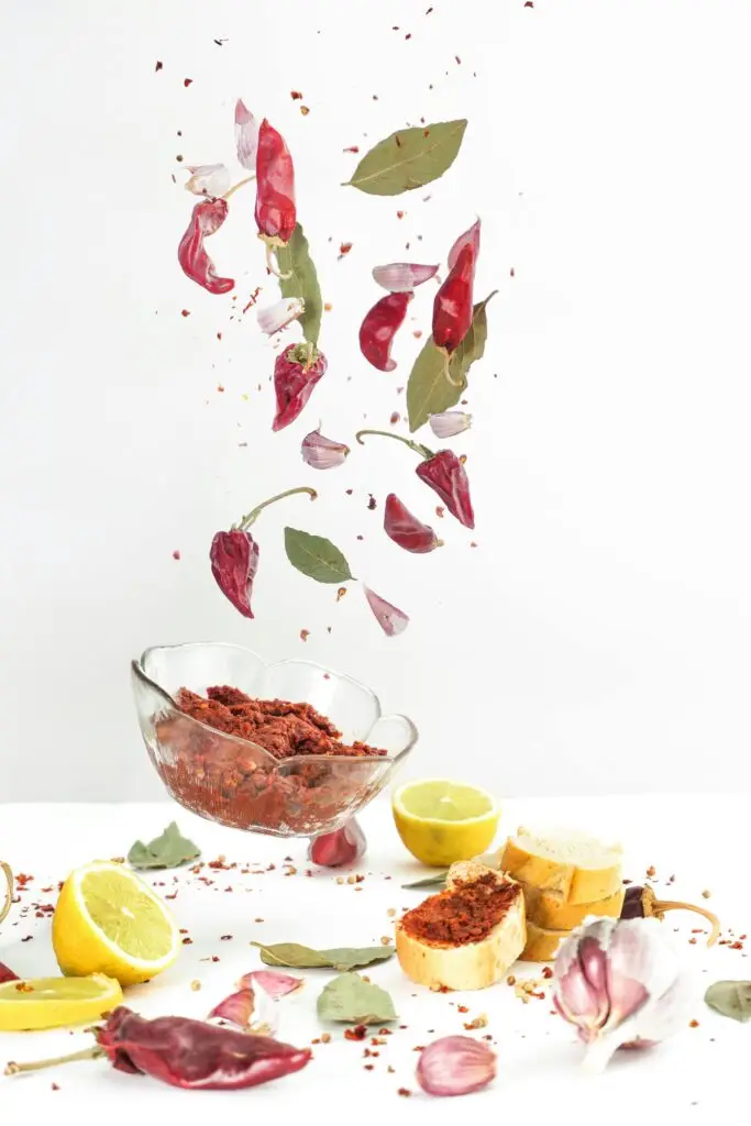 Artistic photo of spices and ingredients in motion, perfect for food blogs.