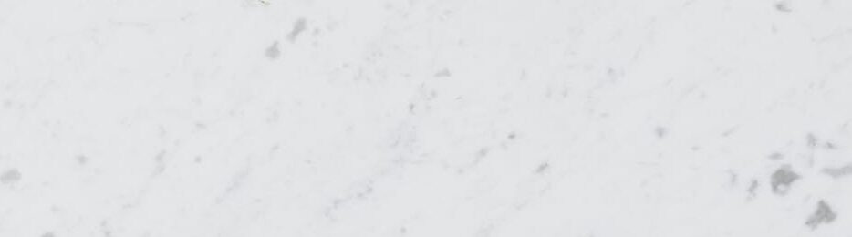 Top view of assorted aromatic condiments arranged together in metal spoons on marble surface used for delicious gourmet meal cooking